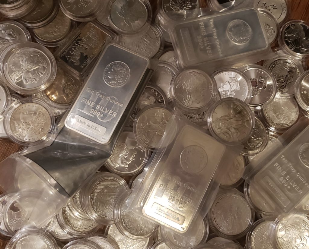 Pile of silver coins and bars