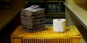 A roll of toilet paper pictured next to 2.6 million bolívars, its price and the equivalent of $0.40 as of August 16, in Caracas, Venezuela.