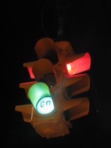 A traffic light with a green light.