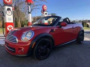 A photo of a red 2015 red Mini-Cooper Roadster convertible. ANYONE can afford silver