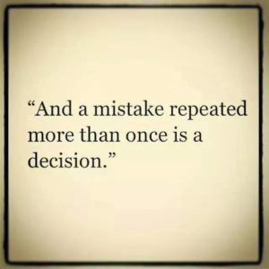 a sign stating " and a mistake repeated more than once is a decision."